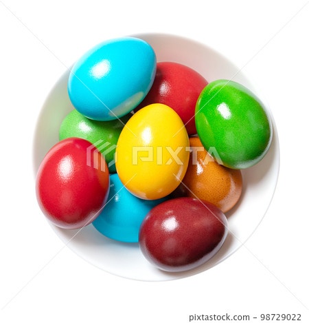 Multicolored Easter eggs in a white bowl. Group of rainbow colored Paschal eggs. Colorful dyed, hard boiled chicken eggs, traditionally used during Eastertide, to celebrate the resurrection of Jesus. Multicolored Easter eggs in a white bowl. Group of rainbow colored Paschal eggs. Colorful dyed, hard boiled chicken eggs, traditionally used during Eastertide, to celebrate the resurrection of Jesus. 98729022