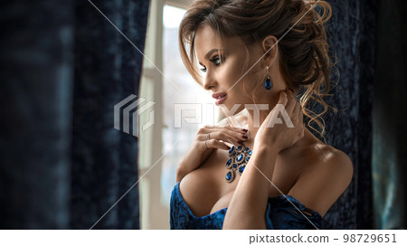 High fashion look.glamor closeup portrait of beautiful sexy stylish Caucasian young woman model with bright makeup, with red lips, with perfect clean skin. 98729651