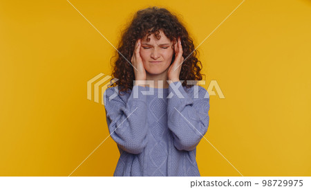 Woman rubbing temples to cure headache problem, suffering from tension and migaine, stress, pain 98729975