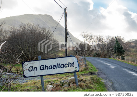 An Ghaeltacht road sign explaining that here starts an area where the irish language is spoken - Translation: Irish An Ghaeltacht road sign explaining that here starts an area where the irish language is spoken - Translation: Irish 98730022