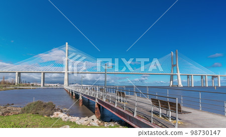The Vasco da Gama Bridge timelapse hyperlapse in Lisbon, Portugal The Vasco da Gama Bridge timelapse hyperlapse in Lisbon, Portugal 98730147