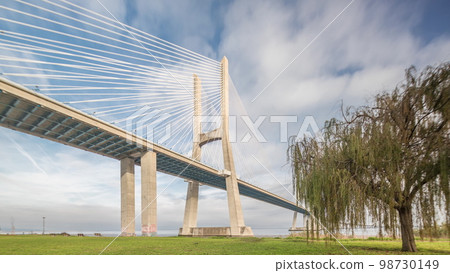 Architectural landmark Vasco da Gama Bridge over the Tagus River in Lisbon, Portugal. 98730149