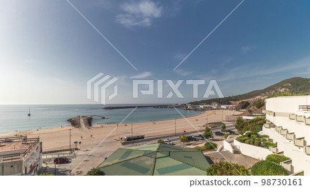 Panorama showing the coastline of the village of Sesimbra timelapse. Portugal Panorama showing the coastline of the village of Sesimbra timelapse. Portugal 98730161
