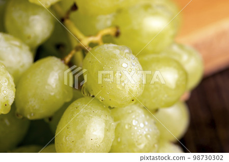 Fresh sweet green grapes, close up Fresh sweet green grapes, close up 98730302