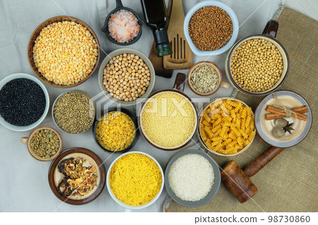 Various vegetarian organic foods in bowls. Rural and farm view. Top view. 98730860