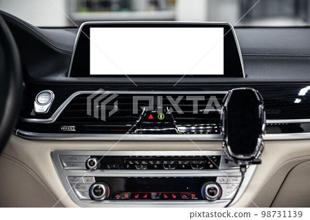 Blank screen of the on-board computer and multimedia systems of a modern car. Blank screen of the on-board computer and multimedia systems of a modern car. 98731139