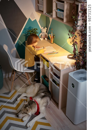 Air purifier in the children's room with an allergy child and a dog Air purifier in the children's room with an allergy child and a dog 98731525