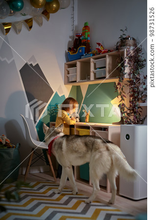 Allergy Child, pet dog and air purifier in children's room Allergy Child, pet dog and air purifier in children's room 98731526