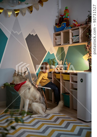 Allergy Child, pet dog and air purifier in children's room Allergy Child, pet dog and air purifier in children's room 98731527