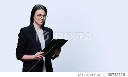 Business woman with documents on clipboard, on white background Business woman with documents on clipboard, on white background 98732610