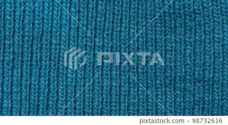 Texture of a knitted blue fabric. Detail of clothing Texture of a knitted blue fabric. Detail of clothing 98732616