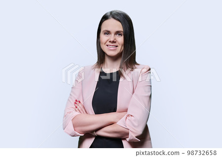 Confident business young female looking at camera on white background 98732658