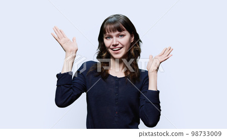 Young attractive female having fun on white background Young attractive female having fun on white background 98733009