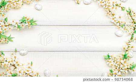 Easter eggs wood. April floral nature, white happy easter eggs on wood spring background. Easter pattern with place for text. Easter eggs wood. April floral nature, white happy easter eggs on wood spring background. Easter pattern with place for text. 98734068
