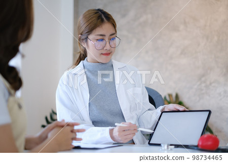 Doctor discussing and explain to patient about life plan. Medicine and health care and insurance concept. 98734465