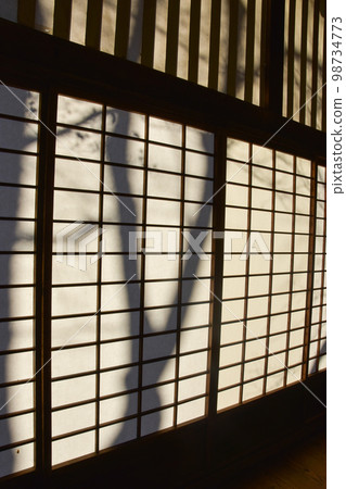 Japanese house Japanese-style room and trees reflected in the shoji screens Japanese house Japanese-style room and trees reflected in the shoji screens 98734773