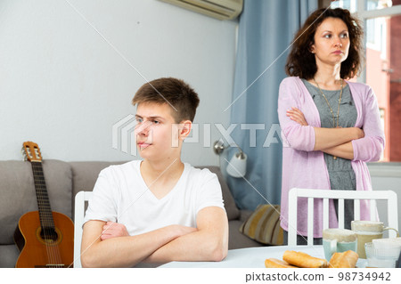 Offended mother and teenage son 98734942