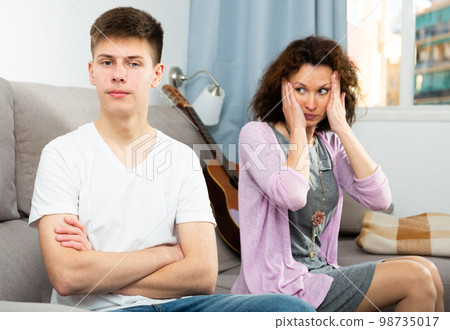 Offended mother and teenage son 98735017