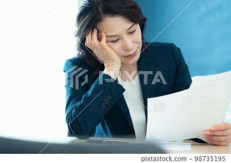 Personnel officer looking at application documents 98735195