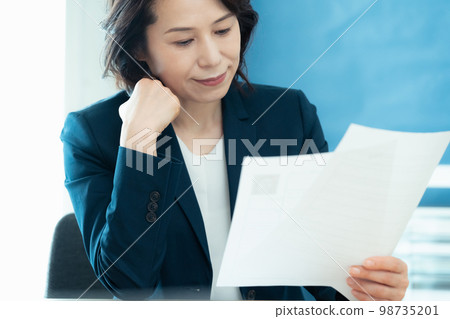 Personnel officer looking at application documents Personnel officer looking at application documents 98735201