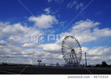 Blue sky and Ferris wheel Blue sky and Ferris wheel 98735816