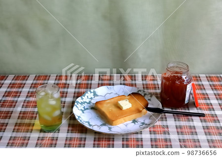 Jam toast and tea for breakfast Jam toast and tea for breakfast 98736656