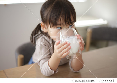 Girl drinking milk Girl drinking milk 98736731