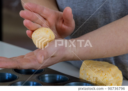 Brazilian cheese bun known as chipa, traditionally used as snack, is prepared by baking it from scratch 98736796