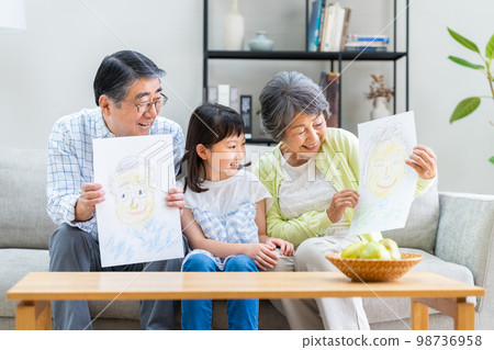 Grandparents and granddaughters in the living room 98736958