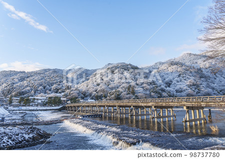 Togetsukyo Bridge in Arashiyama, Kyoto covered in snow 98737780