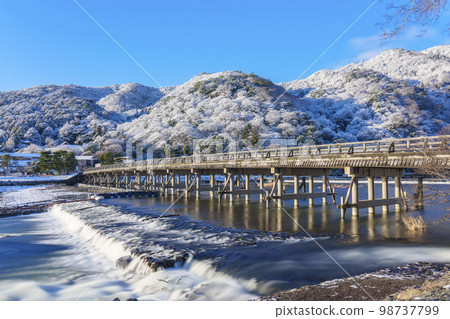 Togetsukyo Bridge in Arashiyama, Kyoto covered in snow Togetsukyo Bridge in Arashiyama, Kyoto covered in snow 98737799
