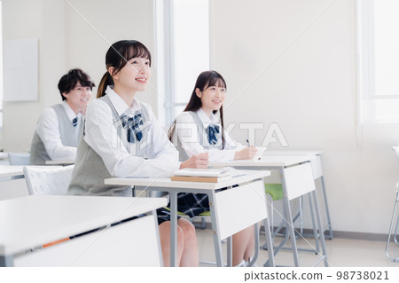 students taking classes in the classroom students taking classes in the classroom 98738021