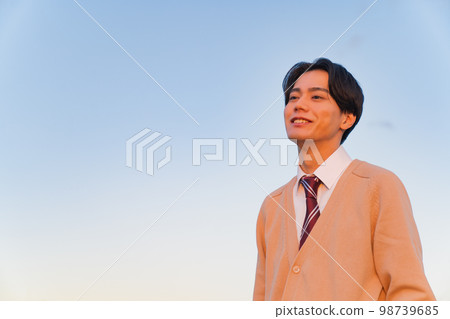 Portrait of a high school boy wearing a cardigan Portrait of a high school boy wearing a cardigan 98739685