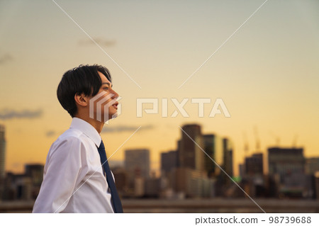 Office workers and buildings sunset Office workers and buildings sunset 98739688