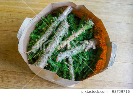 Christmas tree cut into pieces and put in a recycled paper bag after the holiday 98739716
