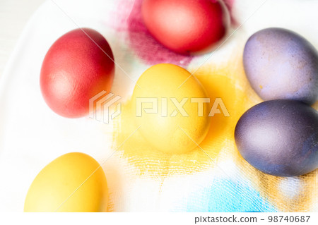 Painted eggs on the table after painting, a symbol of Easter, eggs  98740687