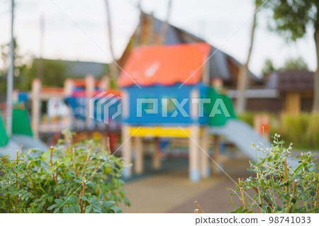 blurred background of playground in park on summer day. High quality photo blurred background of playground in park on summer day. High quality photo 98741033