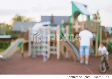 blurred background of playground in park on summer day. High quality photo 98741034