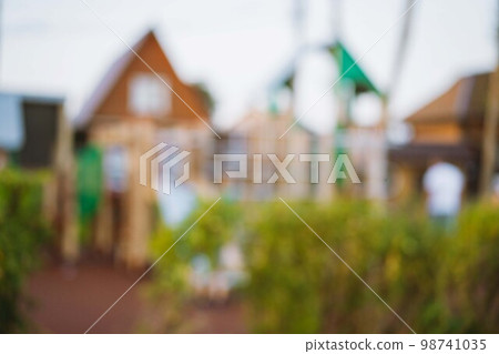 blurred background of playground in park on summer day. High quality photo blurred background of playground in park on summer day. High quality photo 98741035