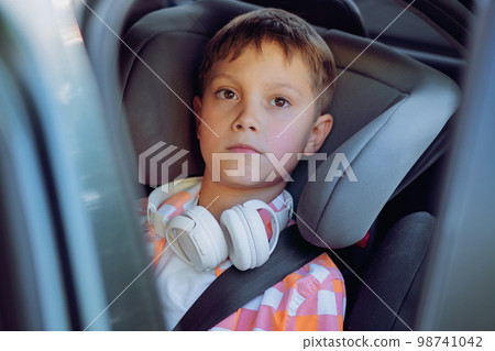 Handsome caucasian boy travelling by car sitting in child seatRecreation concept Handsome caucasian boy travelling by car sitting in child seatRecreation concept 98741042