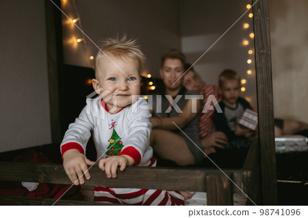 Happy family waiting for christmas. Family at home Happy family waiting for christmas. Family at home 98741096