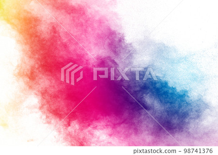 Freeze motion of color powder exploding on white background. 98741376