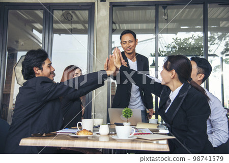 Multiethnic Teamwork friendship group brainstorming togetherness. Business people team holding hands Solidarity. Diversity business partner people teamwork holding hands together power of tag team 98741579