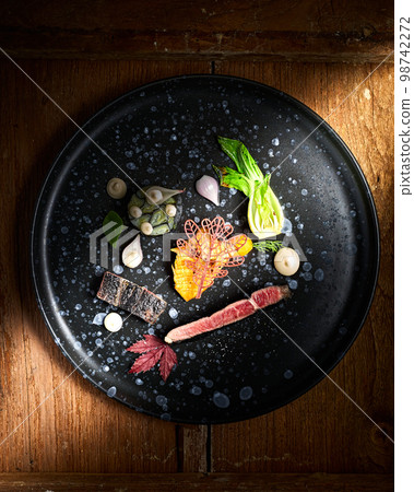 Beautiful and tasty food on a plate, exquisite dish Beautiful and tasty food on a plate, exquisite dish 98742272