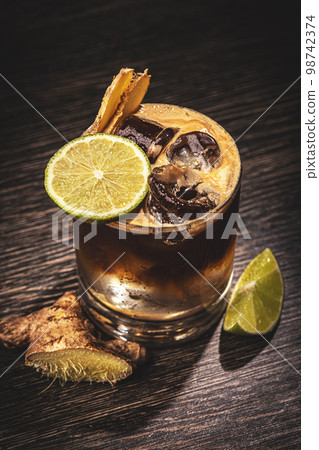 Glass of cola with lime Glass of cola with lime 98742374
