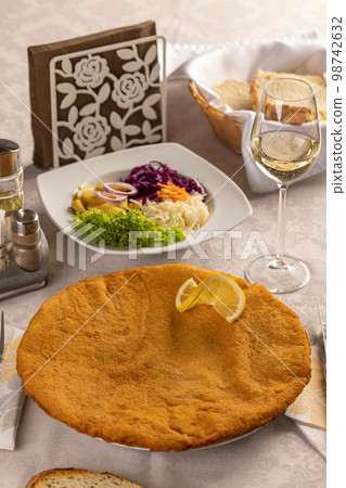 Giant veal viennese schnitzel Giant veal viennese schnitzel 98742632