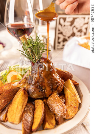 Slow cooked lamb shanks Slow cooked lamb shanks 98742658
