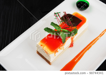 Cheesecake with sauce Cheesecake with sauce 98744341