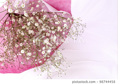 Bouquet of haze grass wrapped in pink Japanese paper 98744458