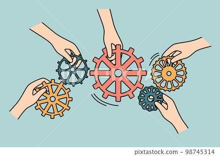 Businesspeople connect cogwheels engaged in teamwork  98745314